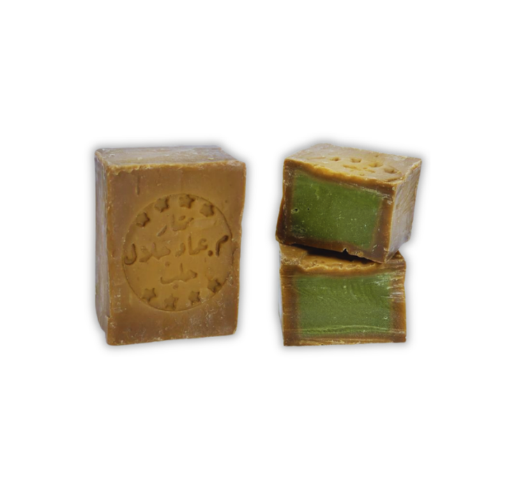 Cross-section of authentic Aleppo Laurel Soap – CHANTEL 40% laurel oil content, showing pure green herbal core, premium quality.